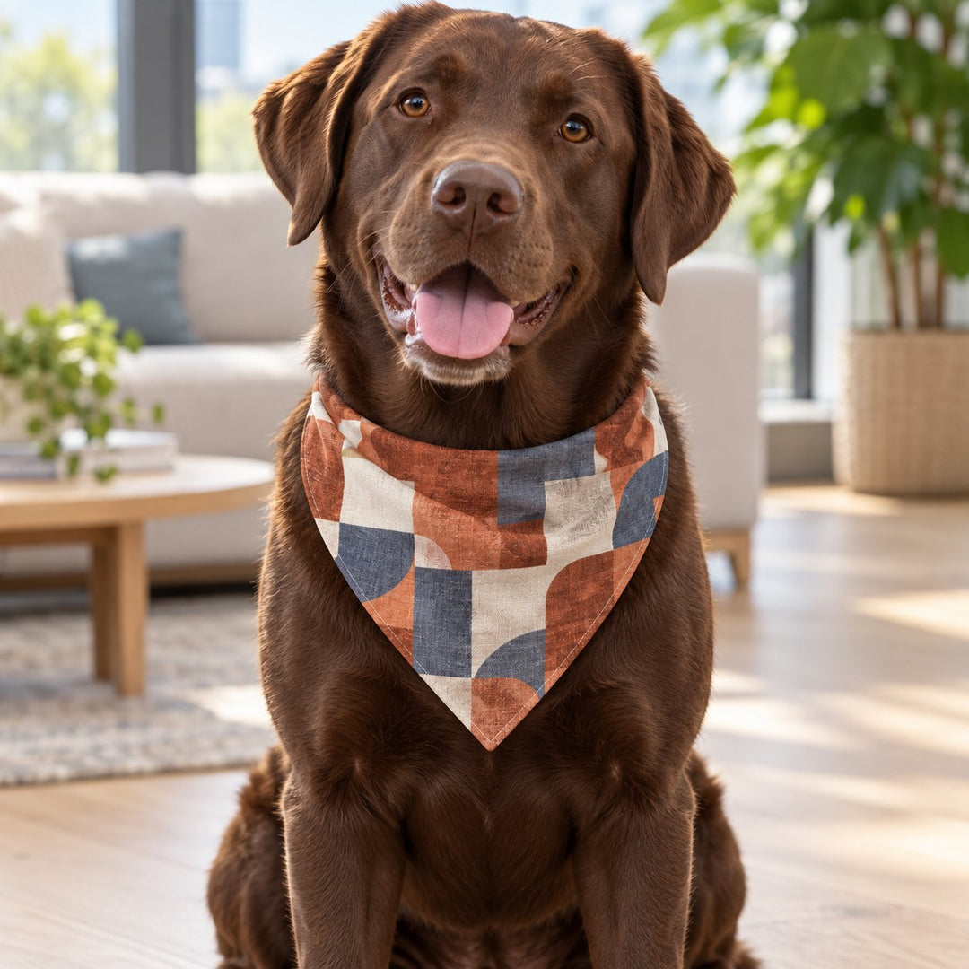 Chocolate Labrador wearing a custom geometric print dog bandana indoors